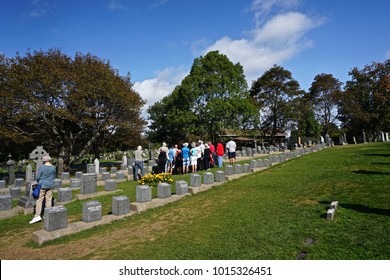Halifax, Nova Scotia / Canada - September 16, 2017: Visitors View The Graves Of 150 Victims Of The Sinking Of The RMS Titanic On April 14, 1912, At Fairview Lawn Cemetery.