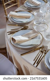 Hall Of An Ancient Castle With Catering For Wedding Events. The Tables Are Set Up With Fine Plates, Glasses And Cutlery