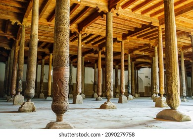 Hall with wooden columns in Juma Mosque, Khiva, Uzbekistan. Columns are unique in that they all different and don't have same design. Many columns brought from older and no longer existing mosques