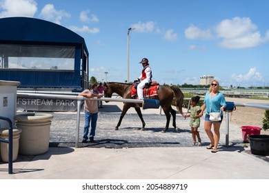 Hallandale Beach, Hollywood Florida Florida United States Of America - August 29, 2021: Gulfstream Park Racetrack, Jockey Walks Past Fans As She Leaves The Race Track.