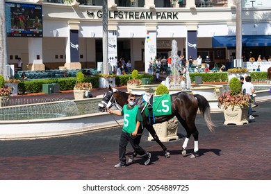 Hallandale Beach, Hollywood Florida United States Of America - August 29, 2021: Gulfstream Park Racetrack, The Jockey Goes With The Horse Prior To The Start Of The Race Track.