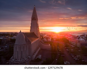 Hallgrimskirkja Church In Reykjavik During Sunset With Flying Birds In Background, Iceland, Most Beautiful Church In The World, Drone Aerial Shot - Image, Amazing View On Icelandic Capital 