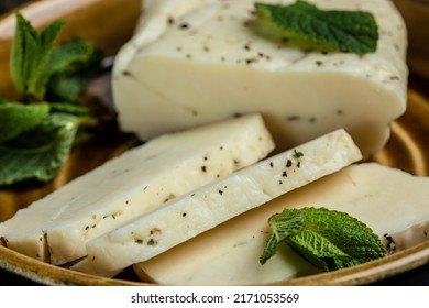 Halloumi Cheese With Mint. Cheese For Grilling, Cyprus Squeaky Cheese. Food Recipe Background. Close Up.