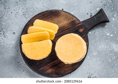 Halloumi Sliced Cheese On Kitchen Table. Gray Background. Top View