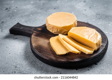 Halloumi Sliced Cheese On Kitchen Table. Gray Background. Top View