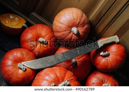Halloween attributes - pumpkin, machet
