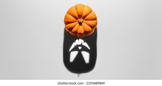 Halloween background concept. Jack O pumpkin angry face shadow. Spooky smiling shadow of an orange pumpkin lantern top view close up, Halloween party design - Shutterstock ID 2193489849