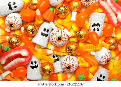 Halloween background of mixed candies, orange color theme - Powered by Shutterstock