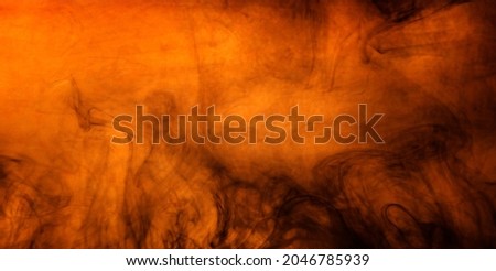 Halloween background with orange texture and scary black smoke swirls. Spooky halloween design backdrop design. 