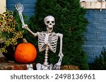 Halloween background. Halloween pumpkin and skeleton for decorated house. Scary Decorated at front yard of a American home. Trick or treat. Halloween background. Autumn holiday of Halloween.