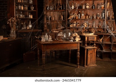 Halloween background Shelves with alchemy tools Skull spiderweb bottle with poison candles Witcher workspace Scarry room