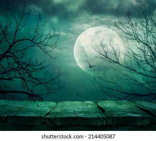 Halloween Background. Spooky Forest With Full Moon And Wooden Table