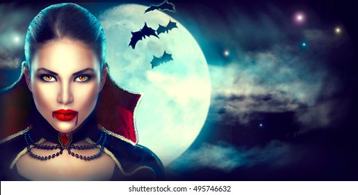 Halloween Background, Vampire Woman portrait. Beauty Sexy Vampire Girl with dripping blood on her mouth. Vampire makeup Fashion Art design. Attractive model girl in Halloween costume and make up