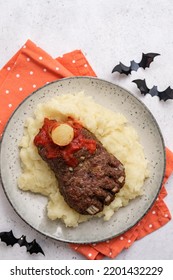 Halloween baked meatloaf feet with mashed potato - Shutterstock ID 2201432229