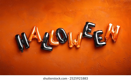 Halloween Balloon Letters in Black and Orange Against a Festive Orange Background - Powered by Shutterstock