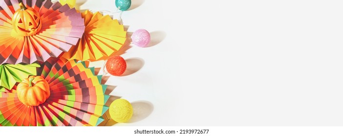 Halloween Banner With Colorful Paper Fans, Decorative Pumpkin, Lightening And Jack O'lantern On A White Background With Place For Your Text. Mexican, Halloween Background. Soft Focus, Banner Size