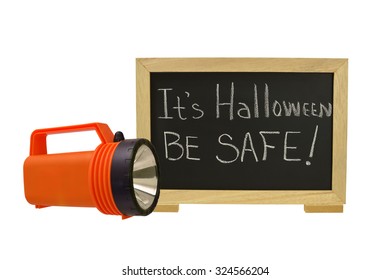 It's Halloween Be Safe!  Blackboard With Orange Flash Light Isolated On White Background