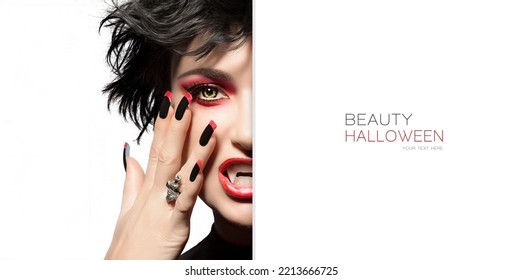 Halloween Beauty And Makeup Concept. Fashion Model Girl With Red Smoky Eye Makeup To Match Her Lipstick And Manicured Nails With Nail Art Black And Red Design. Half Face With A White Card Template.