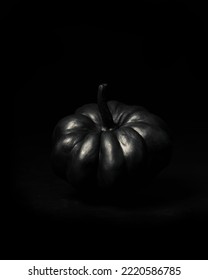 Halloween Black Pumpkins On A Dark Background. Creepy Holiday Decor. Painted Pumpkin. Copy Space.