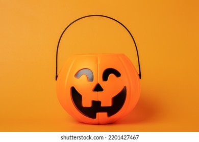 Halloween Candy Bowl On Orange Background