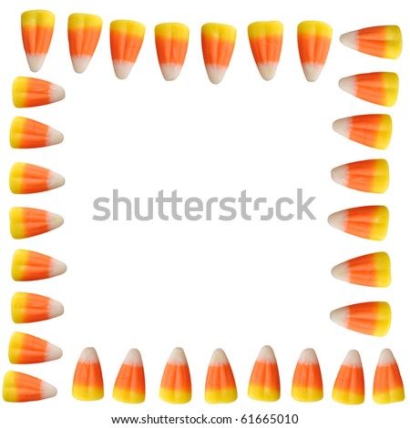 Halloween candy corn arranged in a border isolated on white background