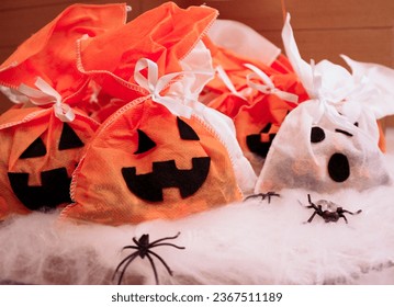 Halloween candy in the shape of a ghost and pumpkin - Shutterstock ID 2367511189