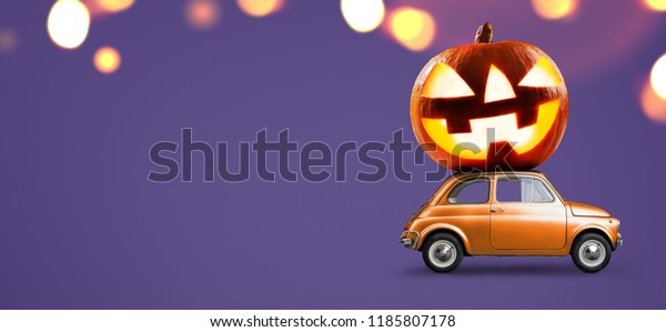 Halloween car delivering pumpkin against night\
scary autumn forest\
background