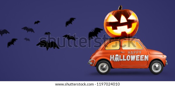 Halloween car delivering pumpkin against
purple background