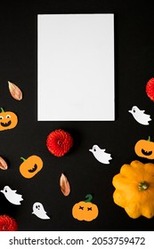 Halloween Card Mockup With Decorations, Pumpkins, Ghosts, Bats On Orange Background. Flat Lay, Top View