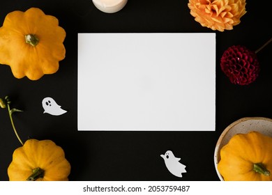 Halloween Card Mockup With Decorations, Pumpkins, Ghosts, Bats On Orange Background. Flat Lay, Top View