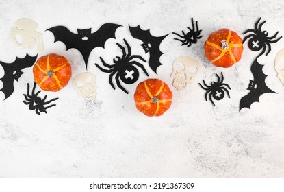 Halloween Celebration Flatlay With Pumkins,bats,spiders And Skulls. Copyspace Banner. October Holidays.