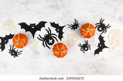 Halloween Celebration Flatlay With Pumkins,bats,spiders And Skulls. Copyspace Banner. October 31 Concept