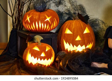 Halloween Composition Of A Burning Pumpkin With A Bat. High Quality Photo