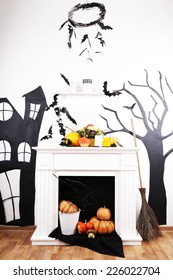 Halloween Composition On Fireplace In Room