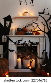 Halloween Composition On Fireplace In Room