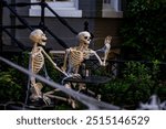 Halloween concept. Halloween pumpkin and skeleton for decorated house. Scary Decorated at front yard of a American home. Trick or treat. Halloween background. Autumn holiday of Halloween.