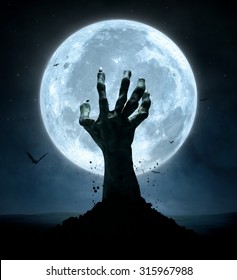 Halloween concept, zombie hand coming out from the grave