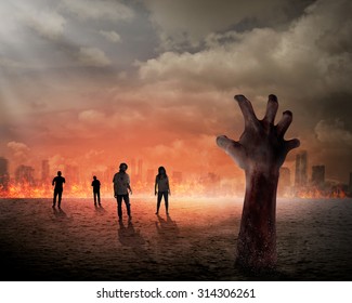 Halloween concept, zombie hand rising out from the ground