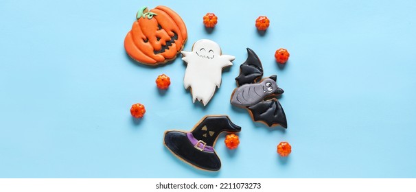 Halloween Cookies With Candies On Light Blue Background, Top View