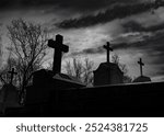 Halloween day concept. Cemetery or graveyard in the night with dark sky. Haunted cemetery. Spooky and creepy burial ground. Horror scene of graveyard. Funeral concept. Halloween day background.