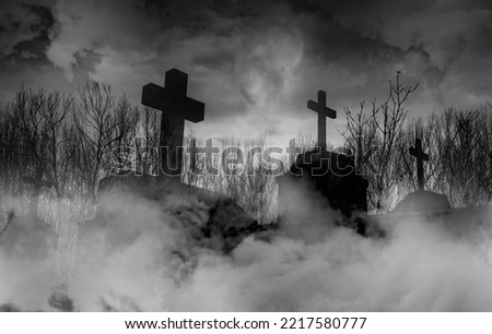 Halloween day concept. Cemetery or graveyard in the night with dark sky. Haunted cemetery. Spooky and creepy burial ground. Horror scene of graveyard. Funeral concept. Halloween day background. 