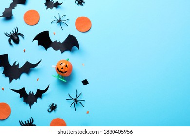 Halloween Decor Elements On Light Blue Background, Flat Lay. Space For Text