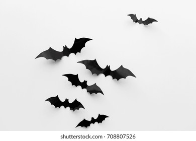 halloween and decoration concept - black paper bats flying over white background - Powered by Shutterstock