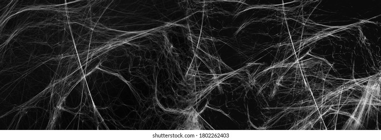 halloween, decoration and horror concept - artificial spider web over black background - Shutterstock ID 1802262403