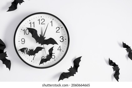 Halloween Decorations Concept. Black Paper Bats Flying Over White Background. Flat Lay, Top View, Copy Space