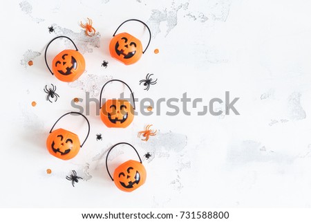 Halloween decorations. Decorative orange pumpkins on white background. Halloween concept. Flat lay, top view, copy space