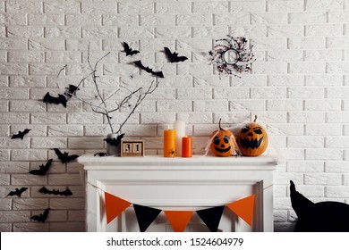 Halloween Decorations On White Fireplace