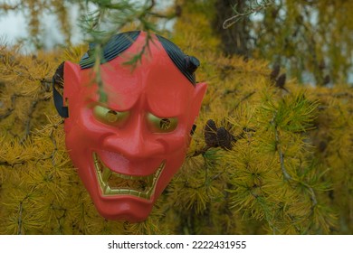 Halloween Devil Mask On A Bush Near The House In The Garden. A Festive Event. Zina, Latvia - 02.11.2022