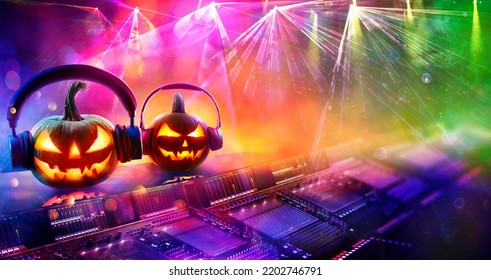Halloween Disco Music - Pumpkins With Headphones In Nightclub With Confetti And Defocused Abstract Lights - Shutterstock ID 2202746791