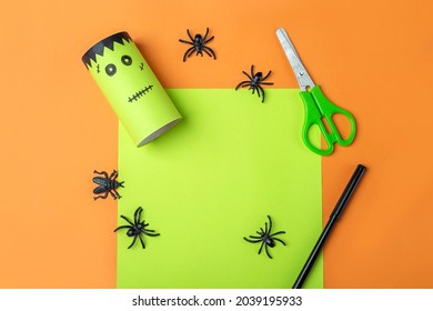 Halloween DIY and kids creativity. Step by step instruction: making green monster frankenstein from toilet roll tube. Step2 finished work. Children Craft. Eco-friendly reuse recycle